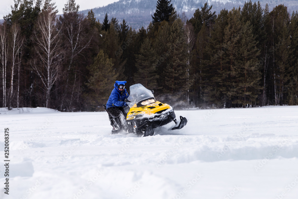 Athlete on a snowmobile.