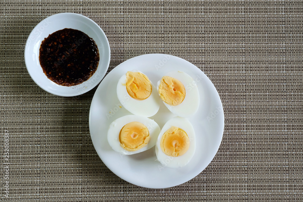 Hard boiled eggs in white dish served in restaurant with space for write wording, delicious high nutrition food that good for muscle, eye, bone and healthy growth for kids, patients and everyone Hard boiled eggs in white dish served in restaurant with space for write wording, delicious high nutrition food that good for muscle, eye, bone and healthy growth for kids, patients and everyone