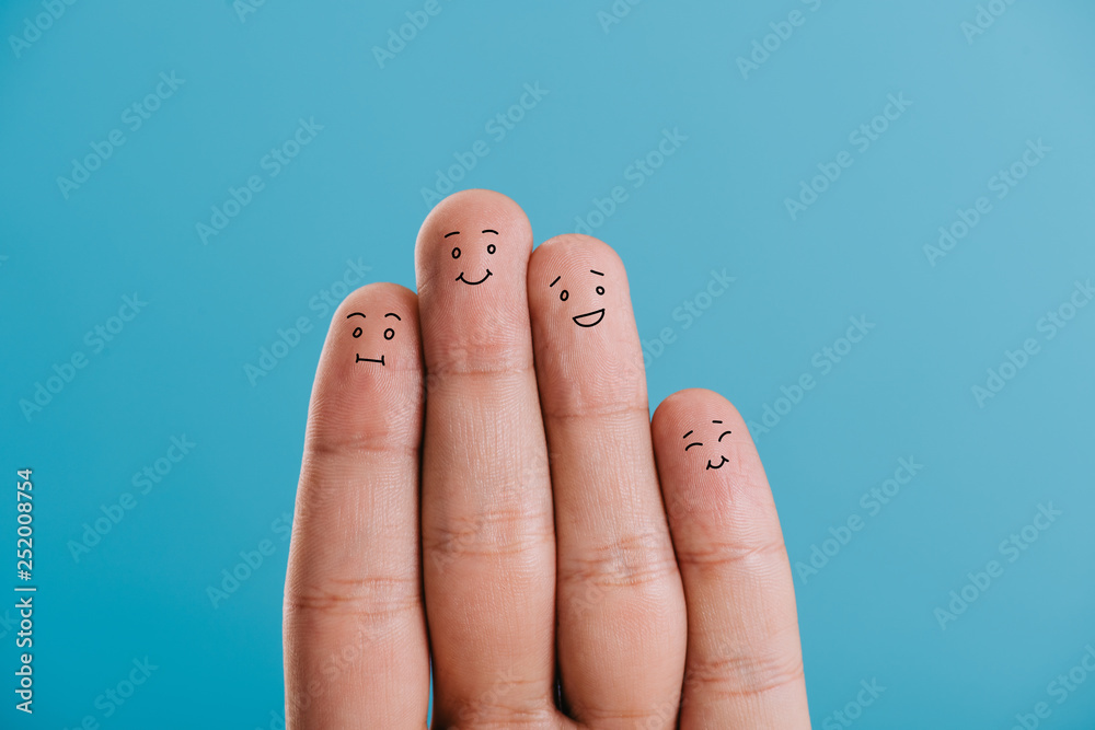 cropped view of happy fingers family isolated on blue cropped view of happy fingers family isolated on blue