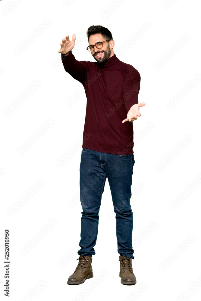 Full-length shot of Handsome man with glasses presenting and inviting to come with hand on isolated white background