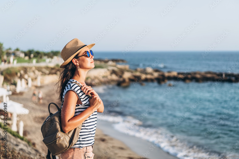 Cute tourist pan asian girl walking outdoor near sea.