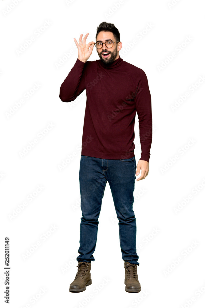 Full-length shot of Handsome man with glasses with glasses and surprised on isolated white background Full-length shot of Handsome man with glasses with glasses and surprised on isolated white background