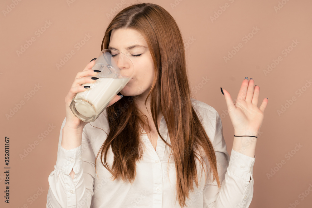 girl drinks milk and is happy girl drinks milk and is happy