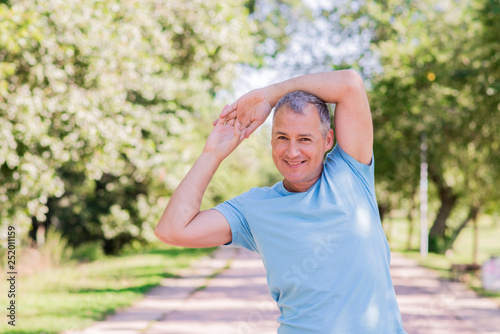 Mature man exercise in a city park