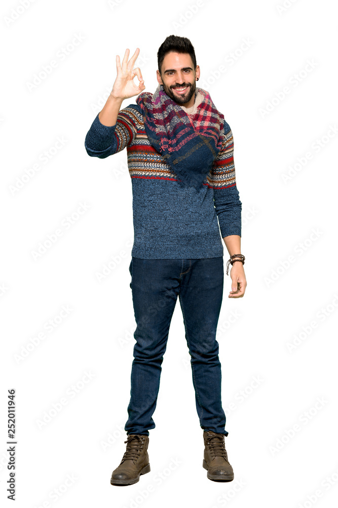 Full-length shot of Hippie man showing an ok sign with fingers on isolated white background Full-length shot of Hippie man showing an ok sign with fingers on isolated white background