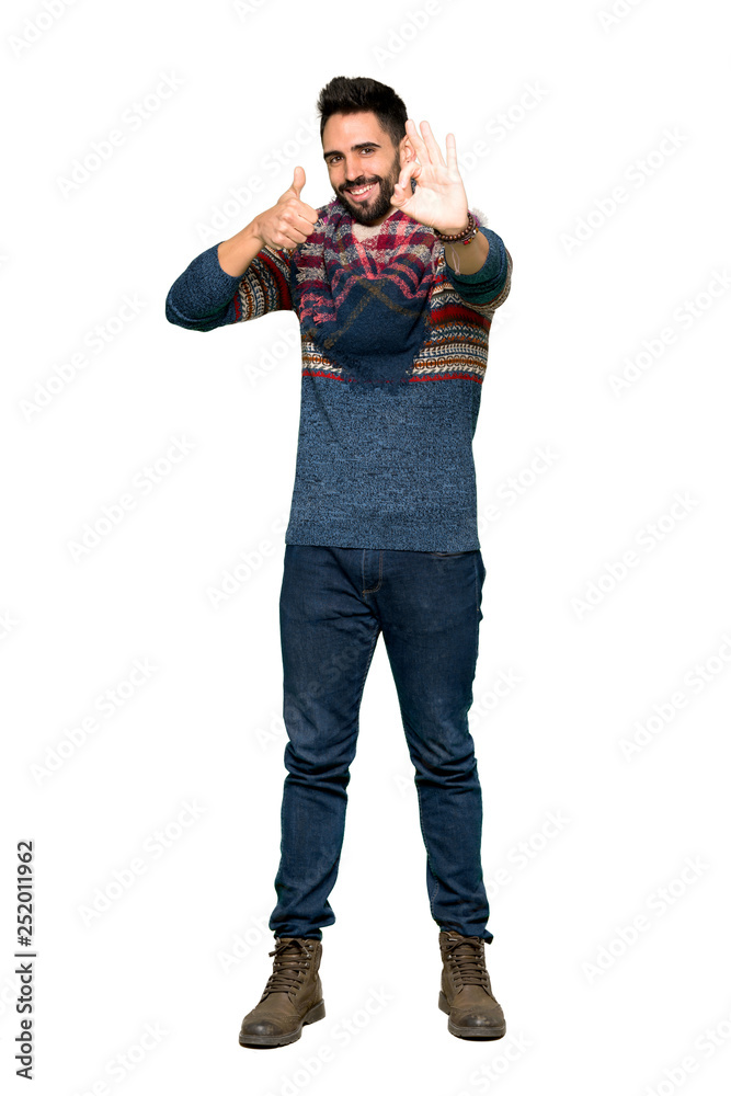 Full-length shot of Hippie man showing ok sign with and giving a thumb up gesture on isolated white background Full-length shot of Hippie man showing ok sign with and giving a thumb up gesture on isolated white background