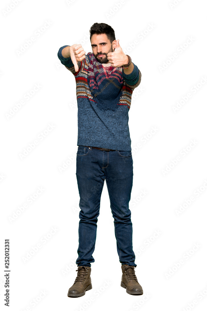 Full-length shot of Hippie man making good-bad sign. Undecided between yes or not on isolated white background Full-length shot of Hippie man making good-bad sign. Undecided between yes or not on isolated white background