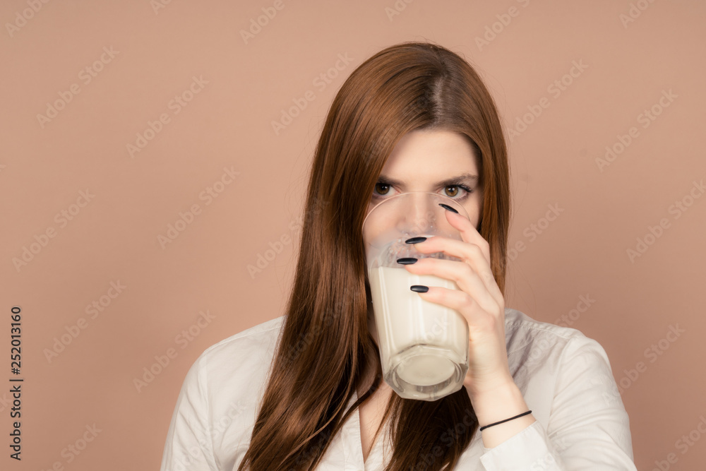 girl drinks milk and is happy girl drinks milk and is happy