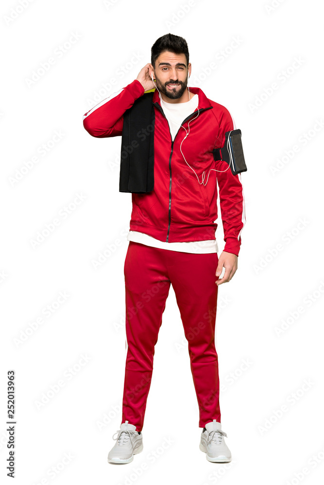 Full-length shot of Handsome sportman having doubts on isolated white background