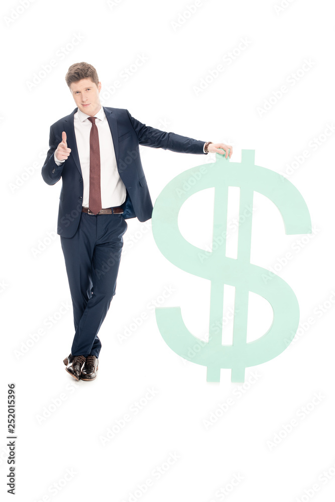 successful young businessman with big dollar sign pointing at you isolated on white successful young businessman with big dollar sign pointing at you isolated on white