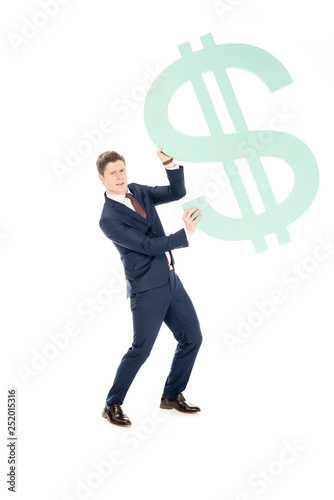 young successful businessman holding big dollar symbol isolated on white