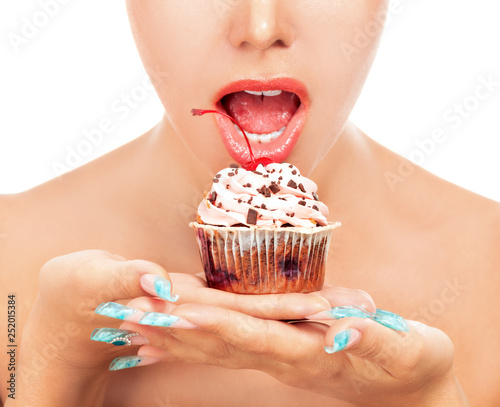 Woman wants to eat a cupcake, isolated on white background