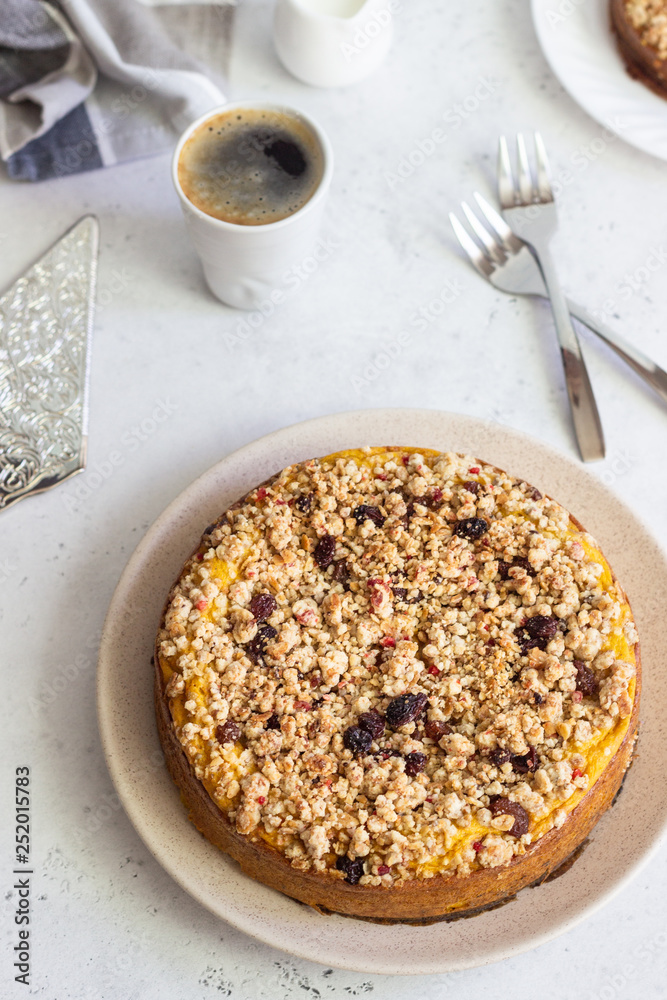 Cheesecake with pumpkin and crumble. No crust cheesecake. Healthy dessert. Light concrete background. Copy space. Cheesecake with pumpkin and crumble. No crust cheesecake. Healthy dessert. Light concrete background. Copy space.