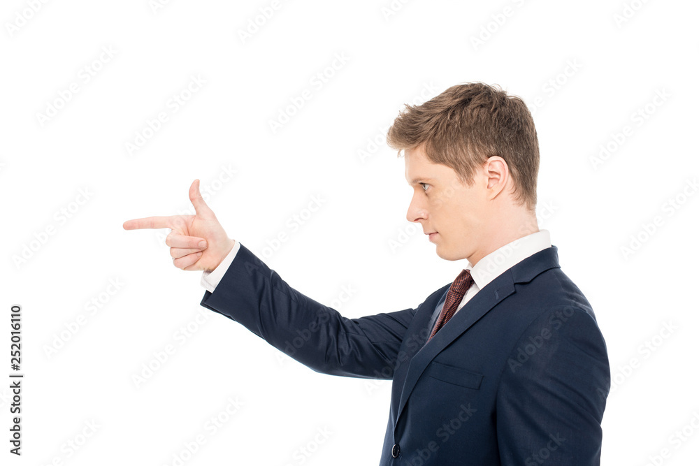 side view of stylish young businessman pointing isolated on white side view of stylish young businessman pointing isolated on white