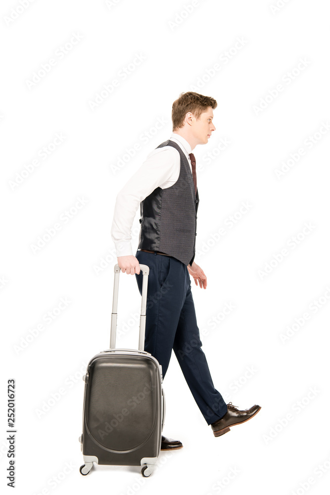 stylish businessman walking with suitcase for business trip, isolated on white