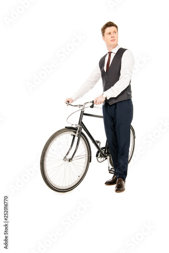 stylish businessman standing with bicycle isolated on white