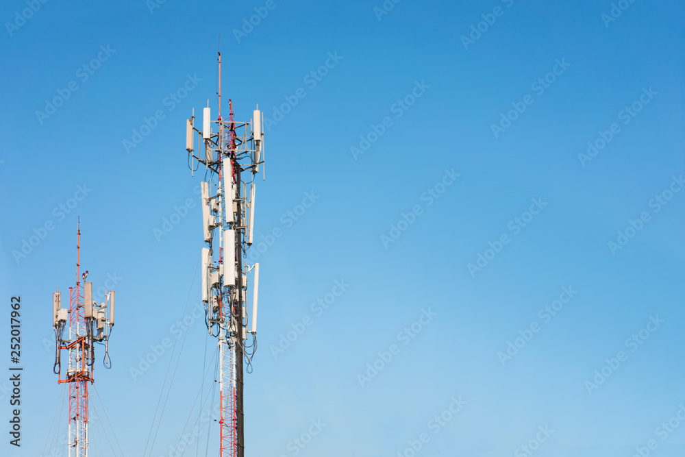 Telecommunication tower on blue sky background.  