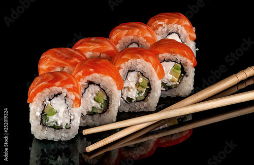 Sushi rolls Philadelphia with chopsticks