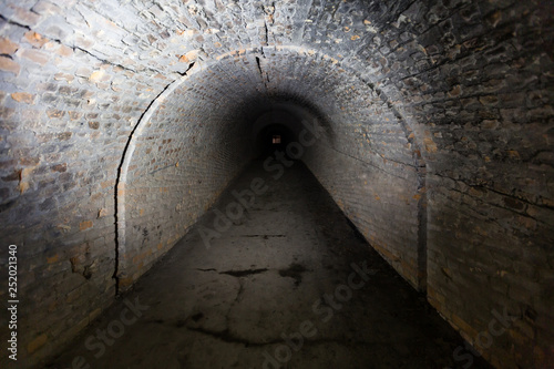 Brick underground tunnel for museum building with illuminated light