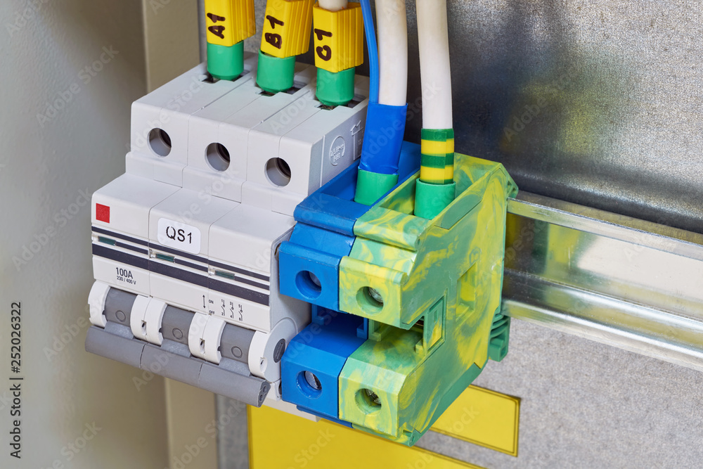 Fototapeta premium The modular circuit breaker and through terminals are located in the electrical Cabinet. Cables or wires are connected to electrical equipment. Modern, reliable and safe industrial equipment.