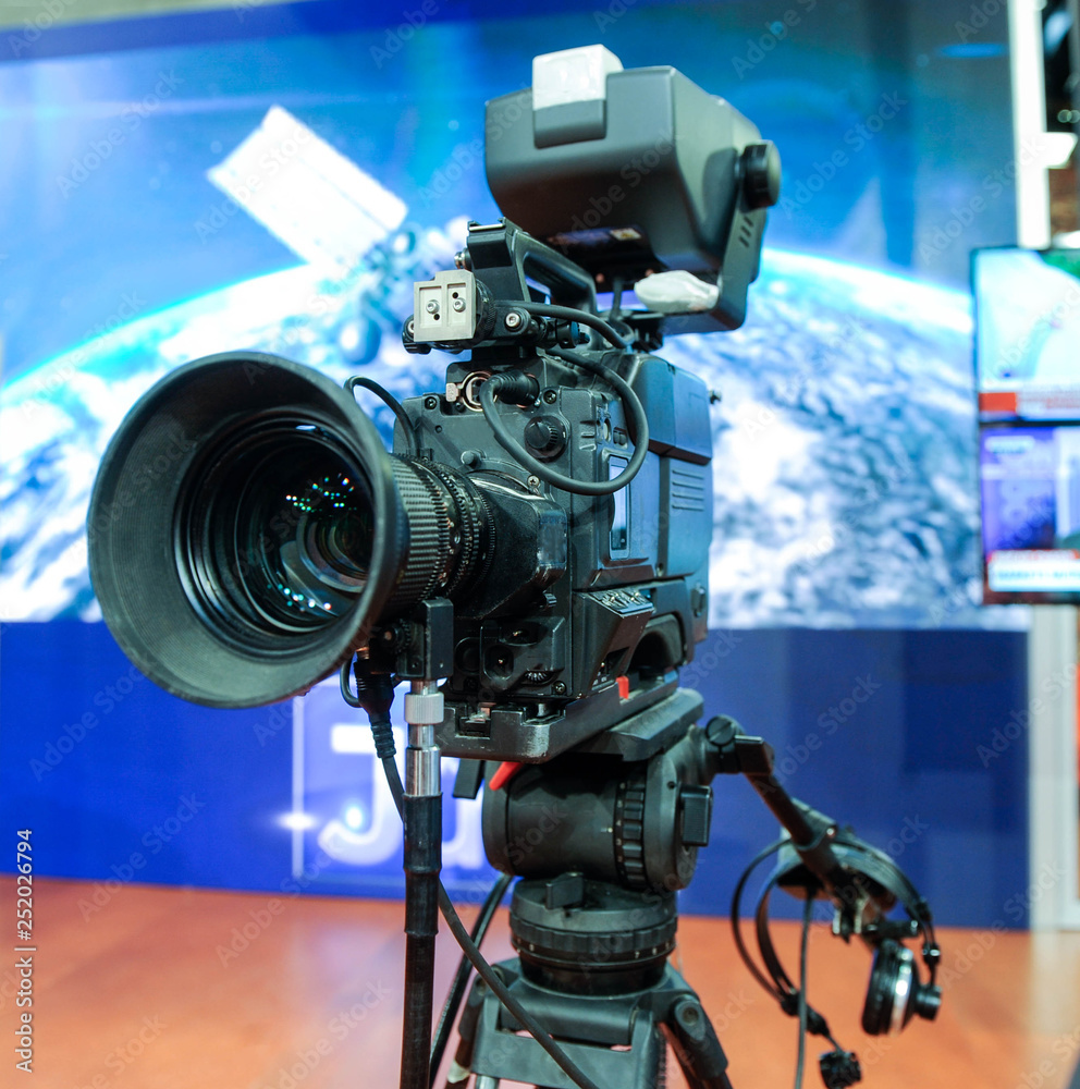 TV camera behind the scenes of video production or video shooting at studio