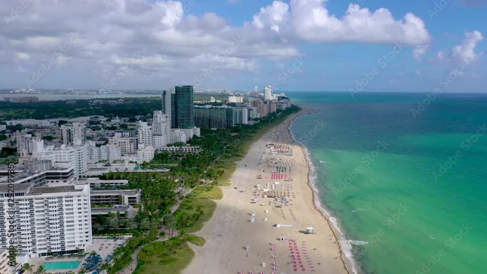 MIAMI, FLORIDA, USA - JANUARY 2019: Aerial drone panorama view flight over South Miami beach ocean coastline. MIAMI, FLORIDA, USA - JANUARY 2019: Aerial drone panorama view flight over South Miami beach ocean coastline.