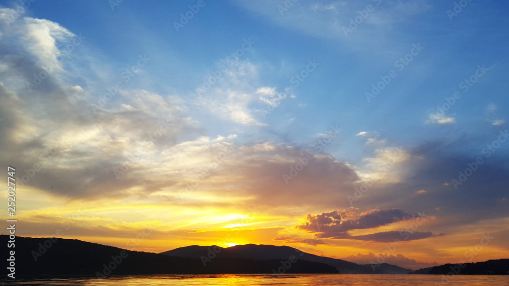 Bright sunset over the sea surface . Evening by the sea. Relaxation Bright sunset over the sea surface . Evening by the sea. Relaxation