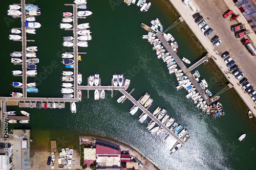 Yacht parking, A marina lot, Yacht and sailboat is moored at the quay, Aerial view by drone.