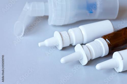 Various nasal sprays and nebulizers for treating colds, rhinitis, and seasonal allergies. Copy space, close up, top view