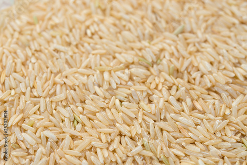 heap of natural whole rice macro