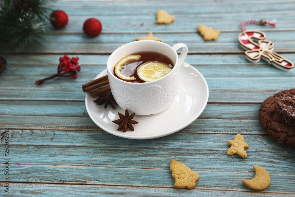 Cup of tea and cookies on wooden table. Christmas, winter xmas concept. Flat lay top view. Cup of tea and cookies on wooden table. Christmas, winter xmas concept. Flat lay top view.