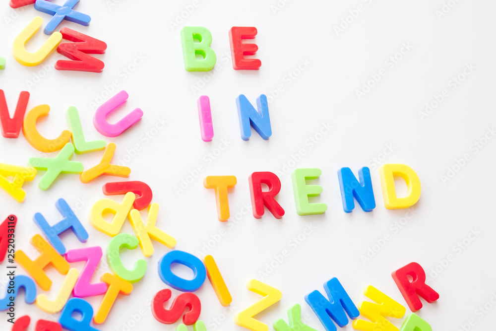 Trends concept. Coloured letters on white background. Be in trend Trends concept. Coloured letters on white background. Be in trend