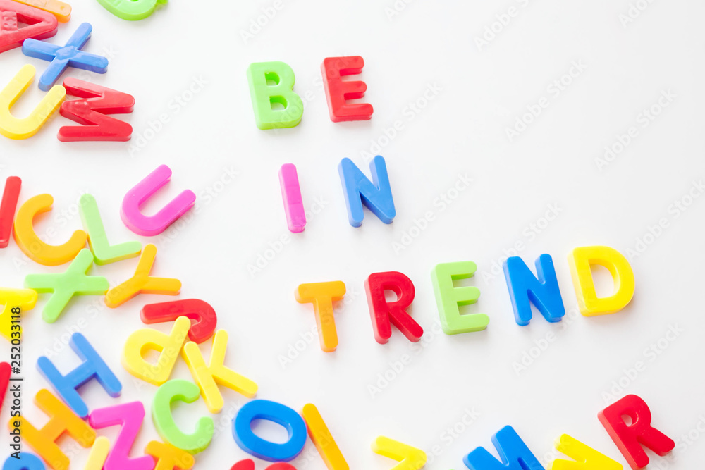 Trends concept. Coloured letters on white background. Be in trend Trends concept. Coloured letters on white background. Be in trend