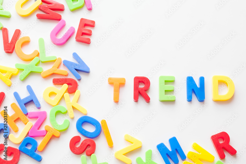 Trends concept. Coloured letters on white background. Be in trend