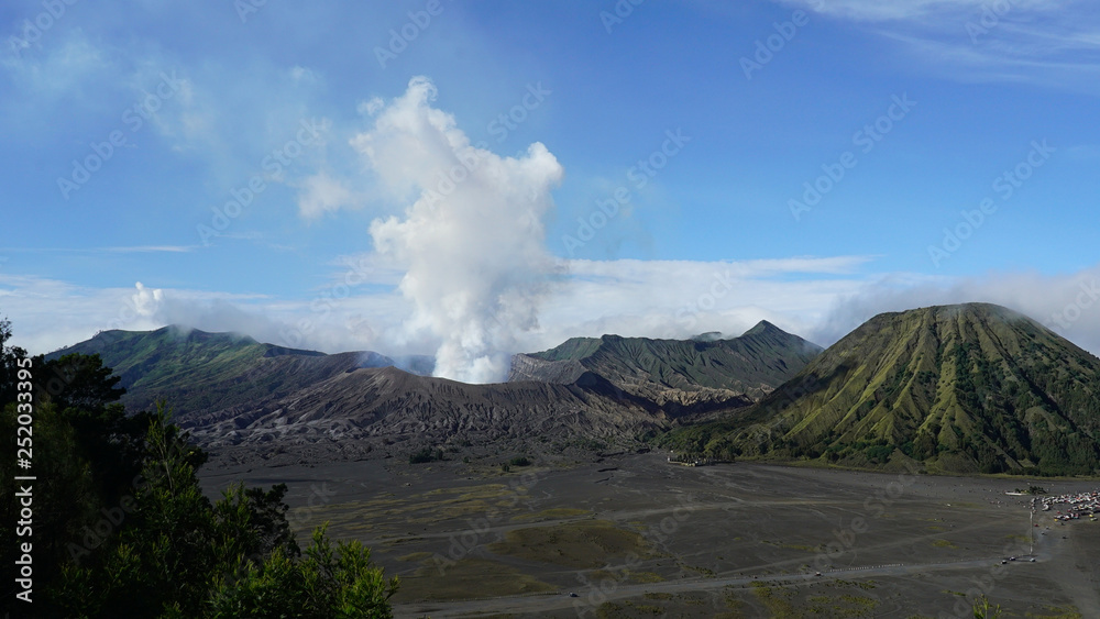 Steam clouds coming out from Mount Bromo, an active volcano in the Bromo Tengger Semeru National Park in East Java, Indonesia.