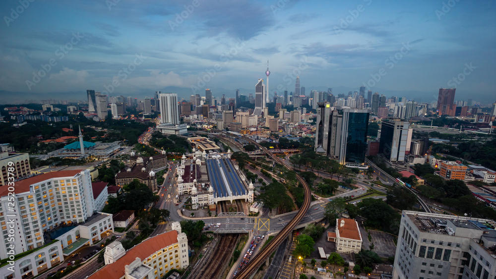 Cloudy sunset over Kuala Lumpur City Skyline showing the transportation arteries withing the heart of the city's transportation hub.