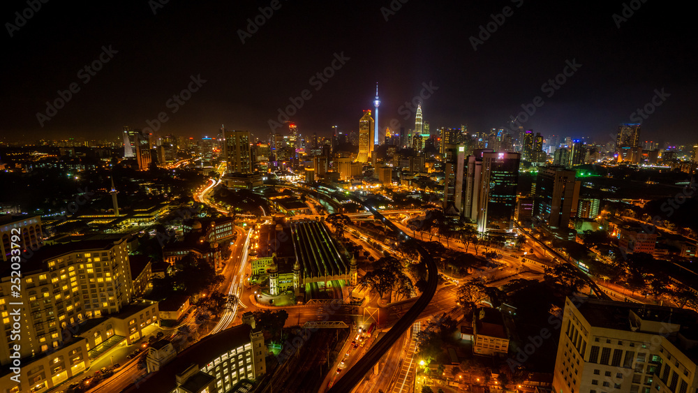 Cloudy sunset over Kuala Lumpur City Skyline showing the transportation arteries withing the heart of the city's transportation hub.