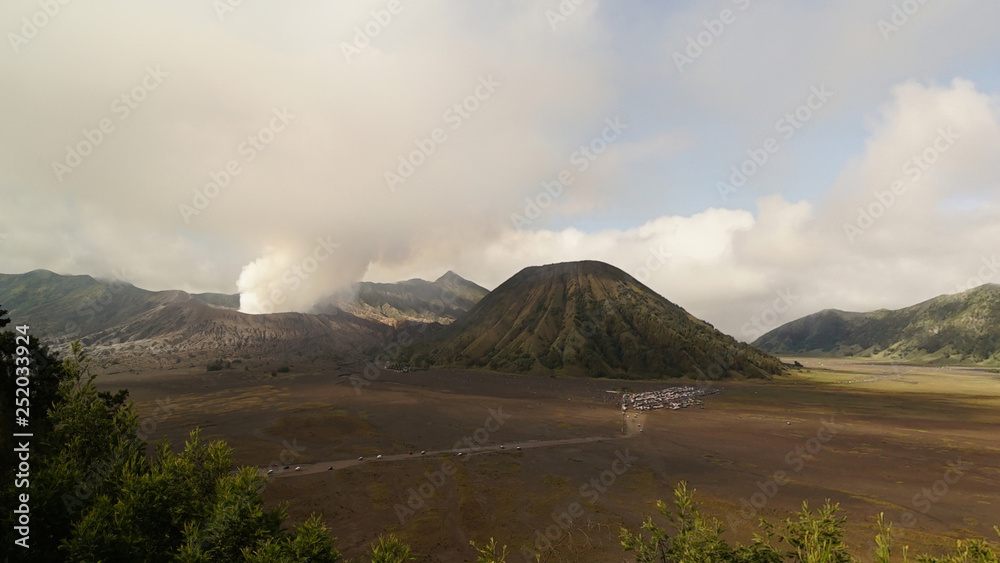 Steam clouds coming out from Mount Bromo, an active volcano in the Bromo Tengger Semeru National Park in East Java, Indonesia.