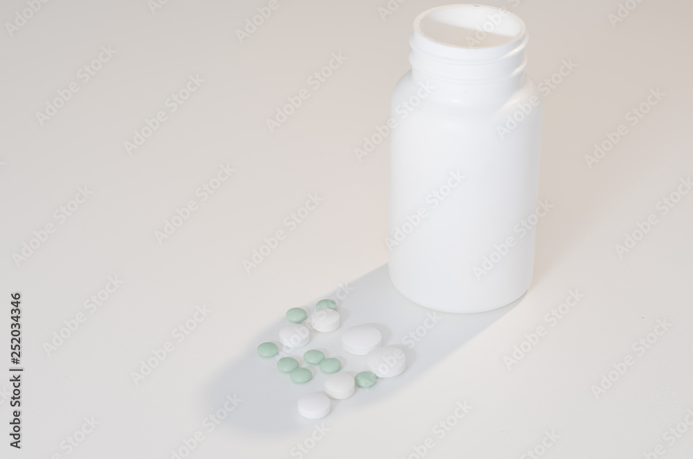 Tablets are laid on a white table. Tablets are laid on a white table.
