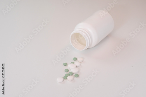 Tablets are laid on a white table.