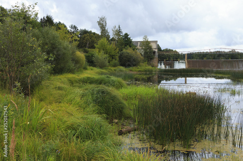 Embankment of hydroelectric power on the river. photo