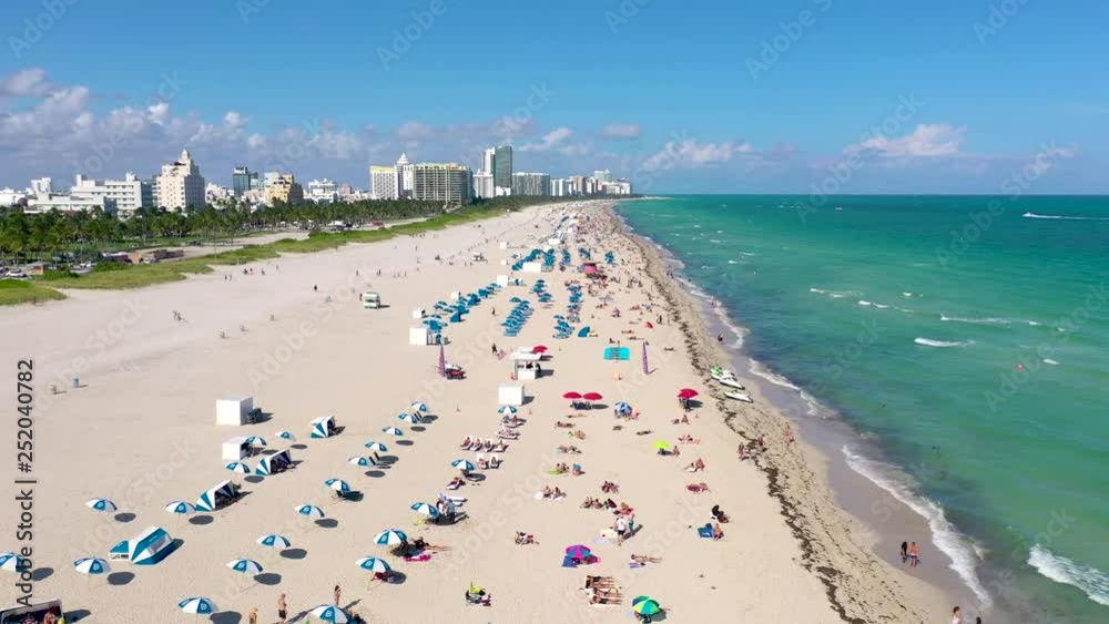 MIAMI, FLORIDA, USA - JANUARY 2019: Aerial drone panorama view flight over South Miami beach ocean coastline. MIAMI, FLORIDA, USA - JANUARY 2019: Aerial drone panorama view flight over South Miami beach ocean coastline.