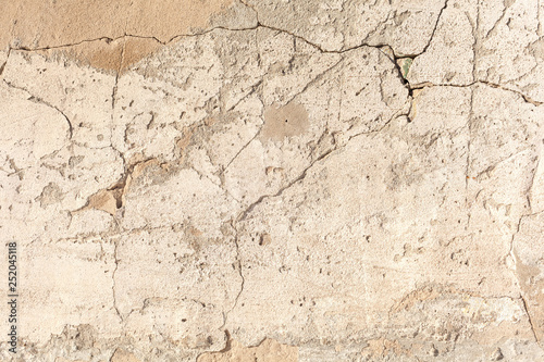 Background texture. Cracked concrete wall covered by grey cement surface