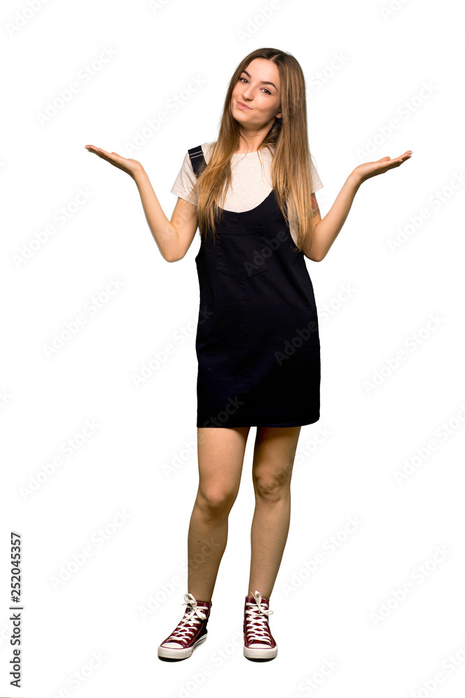 Full body Young pretty woman making unimportant gesture while lifting the shoulders on isolated background Full body Young pretty woman making unimportant gesture while lifting the shoulders on isolated background