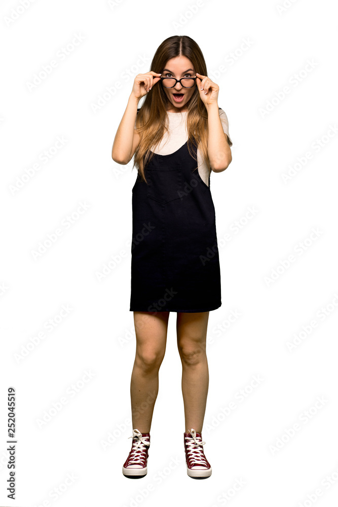 Full body Young pretty woman with glasses and surprised on isolated background Full body Young pretty woman with glasses and surprised on isolated background
