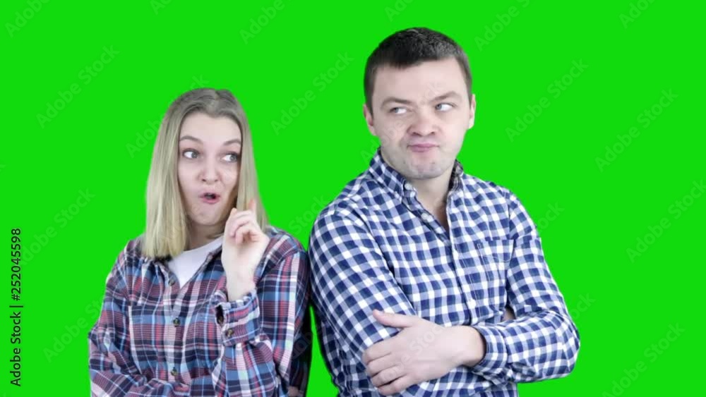 Closeup portrait of family couple, business partners, siblings very thoughtful daydreaming sad serious going through stress, isolated on green background. Chroma key. Closeup portrait of family couple, business partners, siblings very thoughtful daydreaming sad serious going through stress, isolated on green background. Chroma key.