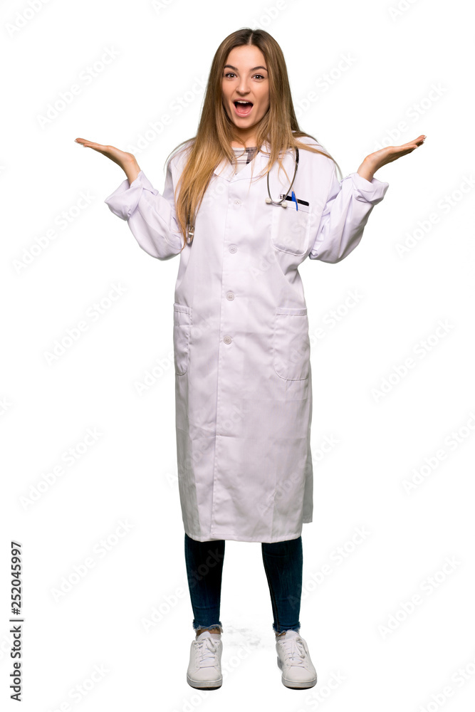 Full body Young doctor woman with surprise and shocked facial expression on isolated background Full body Young doctor woman with surprise and shocked facial expression on isolated background