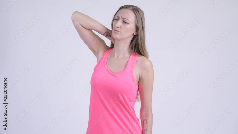 Portrait of stressed blonde woman having neck pain Portrait of stressed blonde woman having neck pain