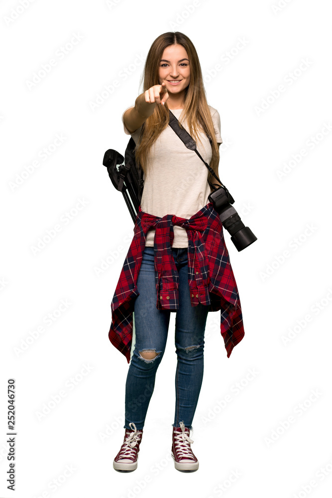 Full body Young photographer woman points finger at you with a confident expression on isolated background Full body Young photographer woman points finger at you with a confident expression on isolated background