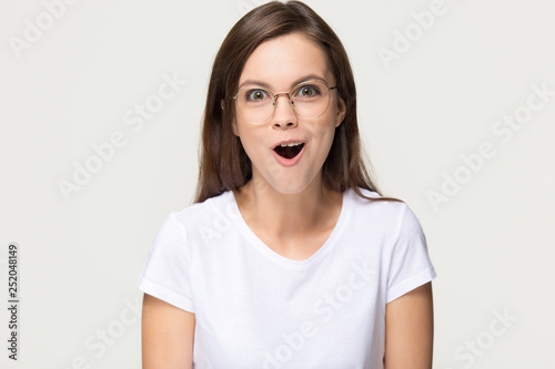 Amazed excited teen girl with wow face isolated on background